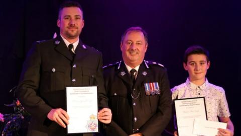 The Chief Constable - Heddlu Dyfed Powys Police with Sergeant Gareth Earp and his son Theo