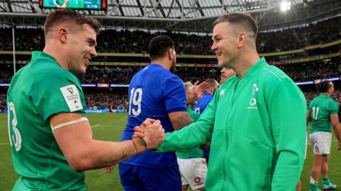 Garry Ringrose and Johnny Sexton celebrate Ireland's win over France