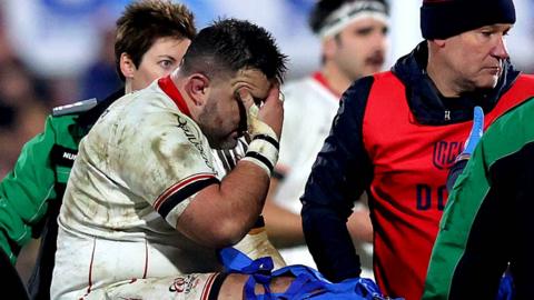 Marty Moore is carried off the pitch after sustaining the injury