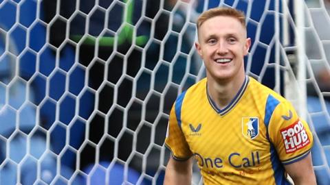 Davis Keillor-Dunn celebrates scoring for Mansfield against Newport