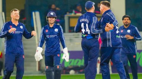 Scotland players celebrate after winning the T20 series against the United Arab Emirates