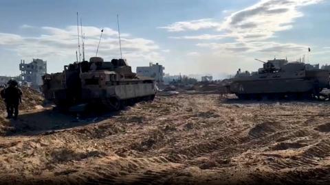 Screengrab of video released by the Israel Defense Forces on 30 October 2023 showing Israeli armoured vehicles inside the Gaza Strip