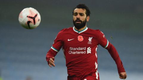 Liverpool forward Mohamed Salah chases down a ball
