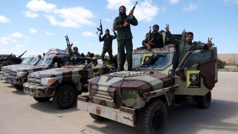 Libyan National Army (LNA) members, commanded by Khalifa Haftar, pose for a picture as they head out of Benghazi to reinforce the troops advancing to Tripoli, on 7 April 2019.