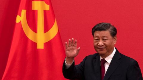 General Secretary and Chinese President, Xi Jinping waves as he leaves after speaking at a press event with members of the new Standing Committee of the Political Bureau of the Communist Party of China and Chinese and Foreign journalists at The Great Hall of People on October 23, 2022 in Beijing, China.