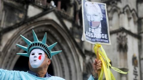 A supporter of Julian Assange outside court on Wednesday