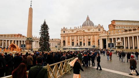Mourners queue to see former Pope Benedict XVI lying in state at the Vatican