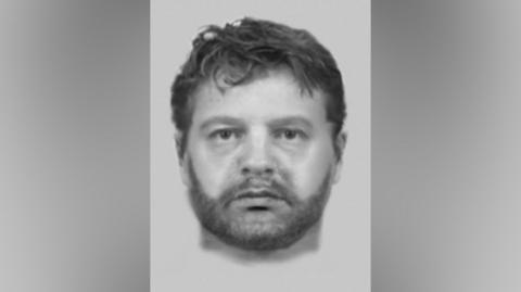 A black and white police drawing of a man with short brown hair and a short dark beard.