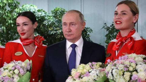 Vladimir Putin with Aeroflot flight attendants