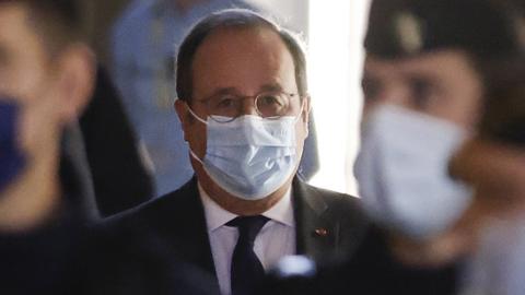 Francois Hollande arrives at the courthouse