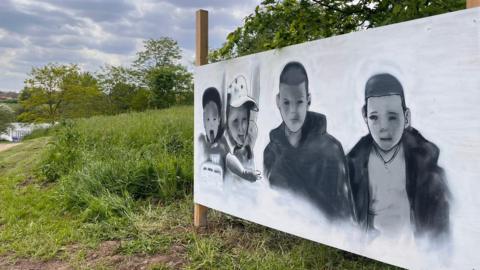 A graffiti tribute to four boys who fell into an icy lake in December has been created by the community.