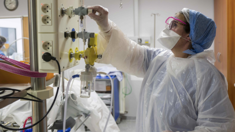 Member of medical staff adjusts oxygen supply in French hospital