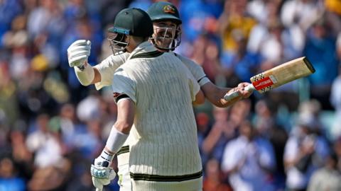 Australia batters Travis Head & Steve Smith embrace