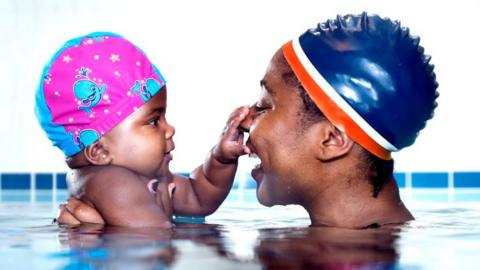 A mum and baby in a swimming pool