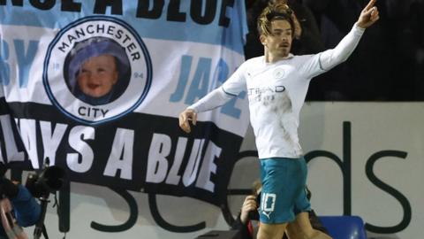 Jack Grealish celebrates scoring for Manchester City against Peterborough in the FA Cup