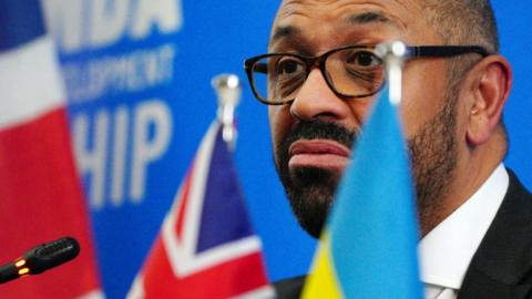 Home Secretary James Cleverly at a press conference in the Rwandan capital Kigali on 5 December 2023