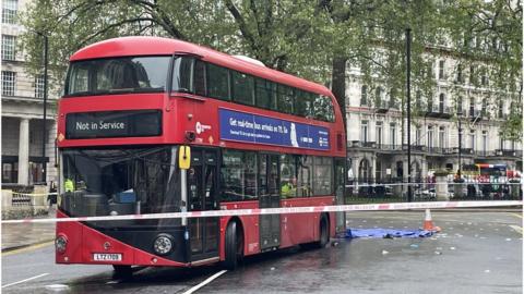 A double-decker bus at the scene