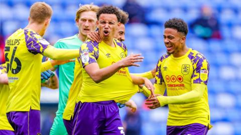 Huddersfield Town defender Rarmani Edmonds-Green (centre)