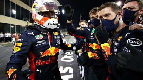 Max Verstappen celebrates with Red Bull pit crew after win in Abu Dhabi