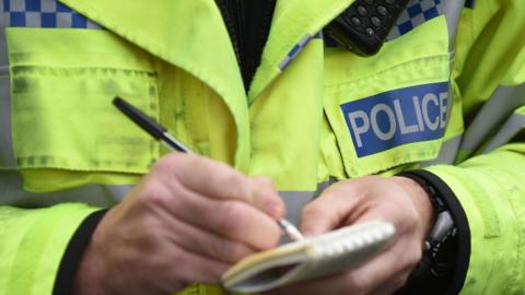 Police man with notebook