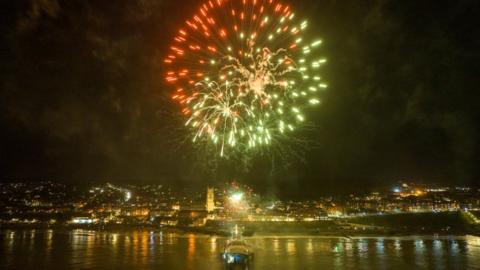 One big firework shines above Cromer Pier.