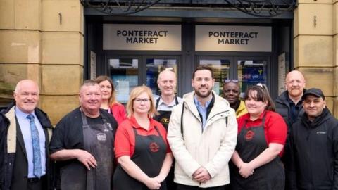 Councillor Michael Graham (centre) with market traders and other representatives