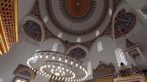 Intricate colourful artwork seen on mosque ceiling