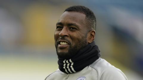 Wes Morgan looks on during a Leicester training session