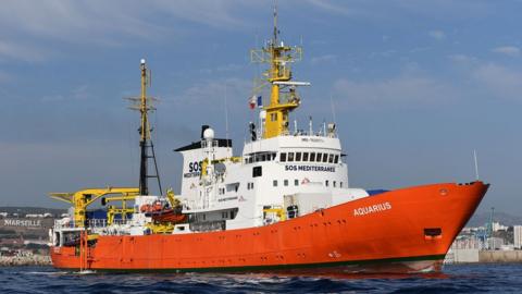 The Aquarius, painted with a bright orange hull and white above-deck structures, leaves Marseilles in this file photo