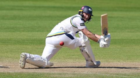 Adam Lyth sweeps a shot for Yorkshire against Glamorgan