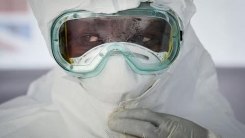 A medical worker pictured wearing Personal Protective Equipment (PPE) during a rehearsal in western Uganda, in December 2018.