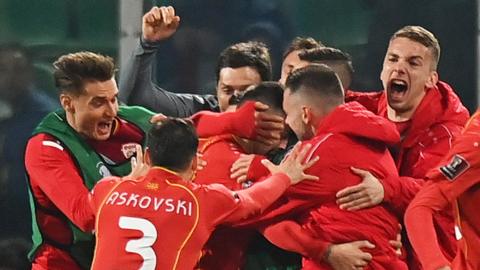 North Macedonia celebrate beating Italy in March 2022