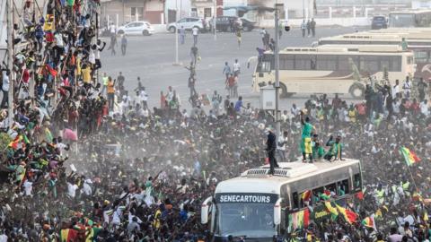 Celebrations surrounding the Senegal team bus