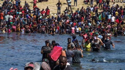 Migrants cross Rio Grande