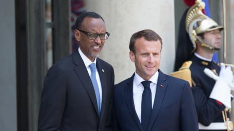 French President Emmanuel Macron (R) welcomes the President of Rwanda Paul Kagame (L) for a meeting at Elysee Palace on May 23, 2018 in Paris