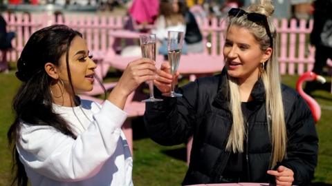 Women with drinks in Liverpool