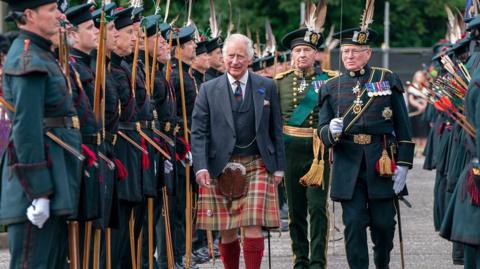 King Charles III inspects the Royal Company of Archers Guard of Honour