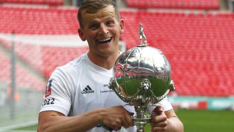 AFC Fylde striker Danny Rowe celebrates with the FA Trophy