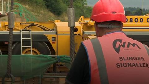 Man looking at machinery