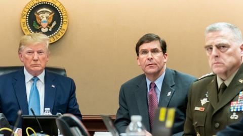 Handout photo provided by the White House, showing President Trump, Secretary of Defense Mark Esper and Chairman of the Joint Chiefs of Staff Gen Mark Milley