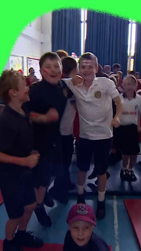 Young England fans celebrating the victory over Mexico at the FIFA World Cup.