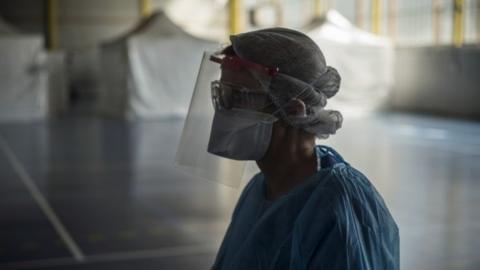 A health care worker waits in an emergency centre in France