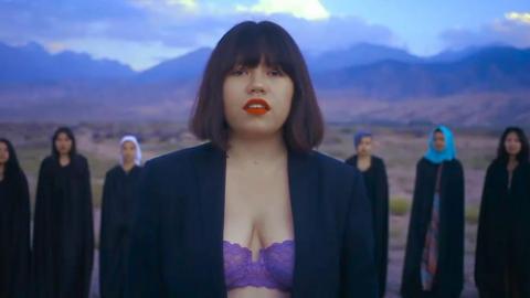 Singer Zere wearing a bra in her music video