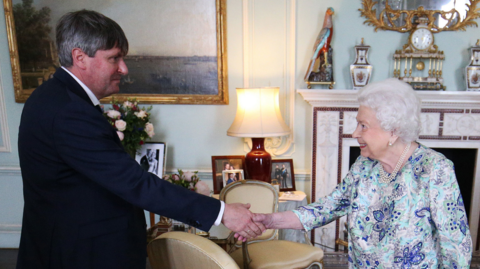 Queen Elizabeth II presents Simon Armitage with The Queen's Gold Medal for Poetry upon his appointment as Poet Laureate during an audience at Buckingham Palace on May 29, 2019