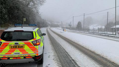 North Wales Police rural crime team show a snowy street