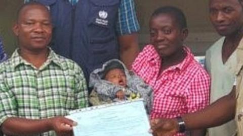 Baby Benedicte is taken home after surviving Ebola