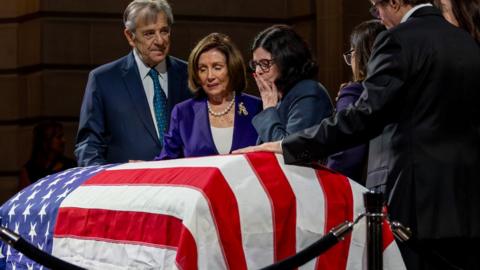 Former House Speaker Nancy Pelosi with her husband Paul, pay respects to Senator Dianne Feinstein with Feinstein's daughter Katherine as the Senator lies in state at City Hall