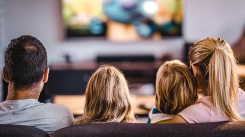 Family watch TV together