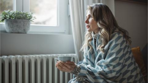 Woman in blanket - stock shot