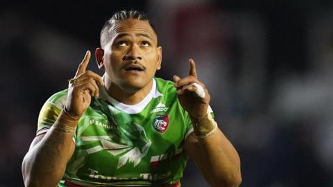 Solomone Kata points is fingers to the sky as he celebrates a try for Leicester Tigers